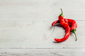 Red chili peppers on wooden background. - PhotoDune Item for Sale