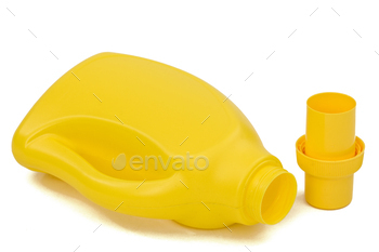 Yellow plastic bottle with a dispenser in cap, isolated on white background.