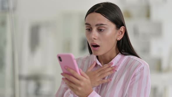 Young Latin Woman Having Loss on Smartphone 