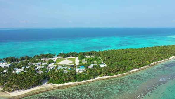 Natural drone island view of a paradise sunny white sand beach and blue water background in vibrant 