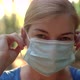 A Woman Wears a Medical Mask in a Park - VideoHive Item for Sale