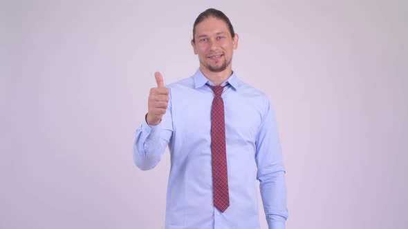 Happy Handsome Businessman Doing Various Gestures While Smiling