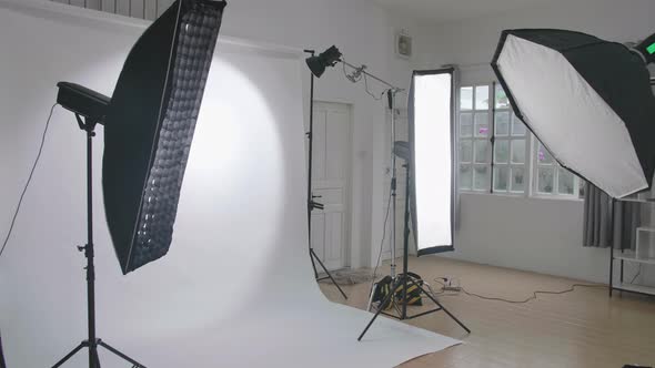 Empty Photo Studio With Lighting Equipment