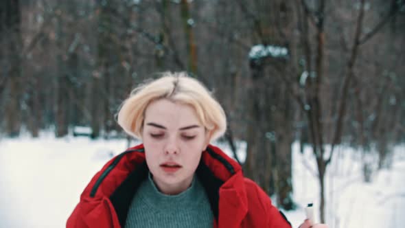 A Blonde Woman Hiking on the Ski in the Woods - Lost and Trying To Find a Way