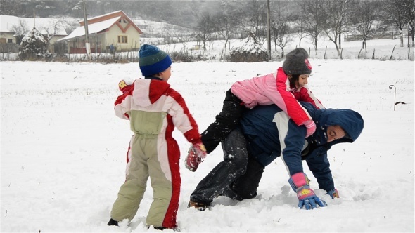 Father And Kids Playing With Snow 2