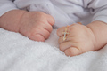 hand of a child with a cross, baptism of a child. - PhotoDune Item for Sale