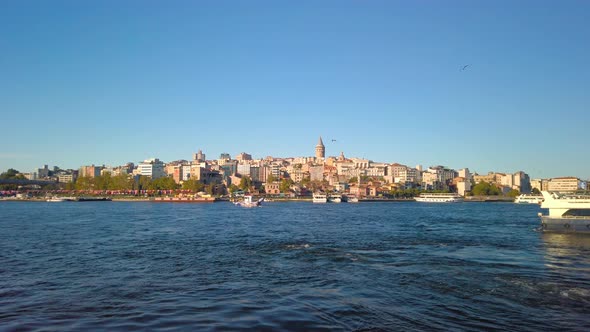 Static view of Galata Tower in distance from the river in Istanbul City. Historic and beautiful Peni