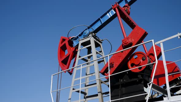 Oil Rig Stands in a Field at and Extracts Minerals