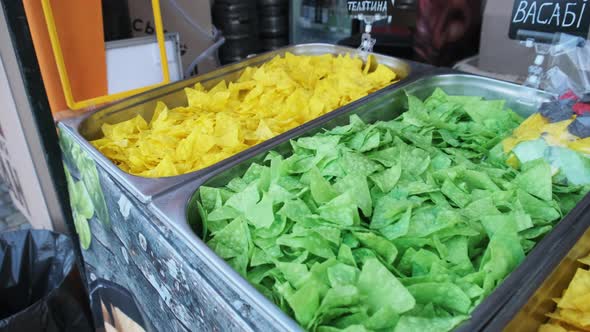 Colorful Potato Chips on Street Food Showcase. Street Fast Food at the Festival