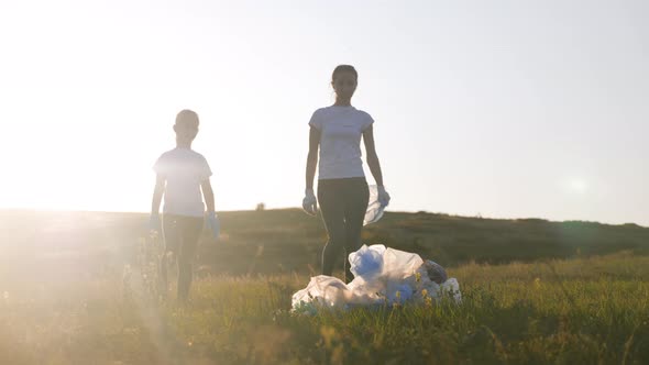 Care About Nature. Volunteer Group Collects Trash in the Trash Bag. Trash-free Planet Concept