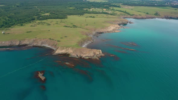 Drone flight around a picturesque rocky coastline