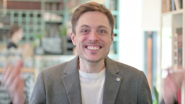 Portrait of Successful Young Man Celebrating