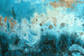 Blue paint peeling off the old concrete wall of a worn house as background - PhotoDune Item for Sale