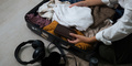 Close up young asian woman traveler pack bags prepare for the travel season vacation, concept - PhotoDune Item for Sale