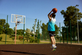 Active teenager boy playing basketball on street outdoor court - PhotoDune Item for Sale