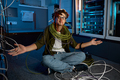 Confused IT networking engineer looking with disbelief on ethernet cables - PhotoDune Item for Sale