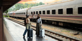 Young two woman happy with life with suitcase waiting for a train tourist adventure holiday - PhotoDune Item for Sale