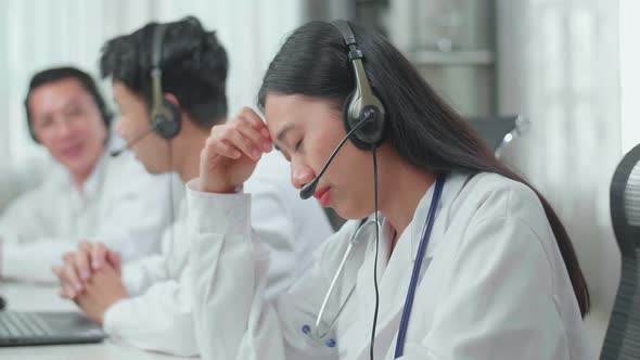 Woman Doctor Working As Call Centre Agent Headache Because Her Colleagues Are Talking During Work