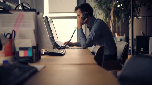 Office Worker Overtime Work In Internet. Businessman Working Alone. Man Remote Working Office.