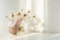 Fluffy dandelions in a glass vase. a delicate airy summer bouquet - PhotoDune Item for Sale