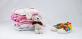 Children's things on a light background. The concept of baby clothes - PhotoDune Item for Sale