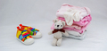 Children's things on a light background. The concept of baby clothes - PhotoDune Item for Sale