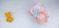 Children's things on a light background. The concept of baby clothes - PhotoDune Item for Sale