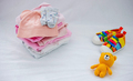 Children's things on a light background. The concept of baby clothes - PhotoDune Item for Sale