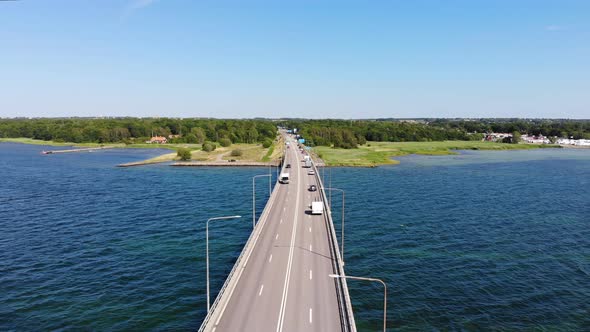 Aerial flying backwards over Oland Bridge in Sweden on a clear sunny summer day