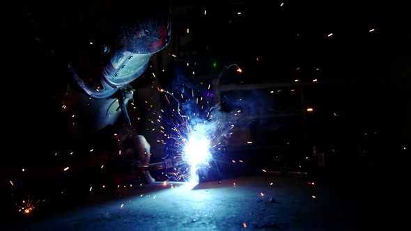 Welder working on a piece of metal