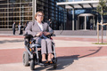 businesswoman using wheelchair at street - PhotoDune Item for Sale