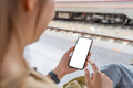 Asian woman using smartphone while waiting train - PhotoDune Item for Sale