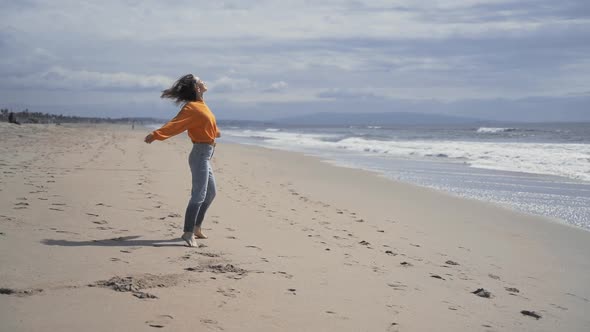 Young smiling girl on the beach