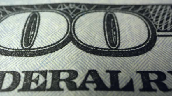 Panning over writing on 100 dollar bill