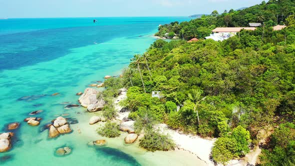 Beautiful above island view of a sandy white paradise beach and aqua blue water background in best q