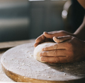Man kneading and baking homemade pizza dough in the kitchen - PhotoDune Item for Sale