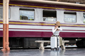 Alone Asian woman traveler with suitcase in train station platform. Summer vacation holiday and - PhotoDune Item for Sale