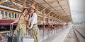 Two women are happy while traveling at the train station. tour concept. Two asian women best friend - PhotoDune Item for Sale