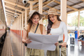 Travel concept. girl friend wear hat holding map have bag and luggage. female traveller waiting - PhotoDune Item for Sale