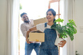 Indian young couple move the box into the home at new home. Relocation, moving to new home concept - PhotoDune Item for Sale