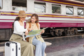 Travel concept. girl friend wear hat holding map have bag and luggage. female traveller waiting - PhotoDune Item for Sale