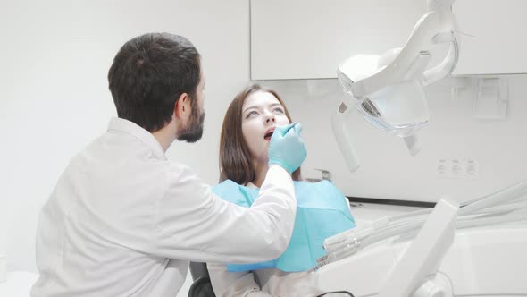 Female Patient Having Dental Checkup By Professional Dentist