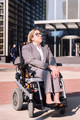 businesswoman using wheelchair at street - PhotoDune Item for Sale
