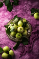 Fresh ripe green apple in purple background. - PhotoDune Item for Sale