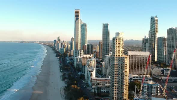 Aerial view of high-rise building built next to a popular tourist beach