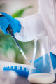 An expert assesses milk quality in a laboratory, using test tubes for analysis. - PhotoDune Item for Sale
