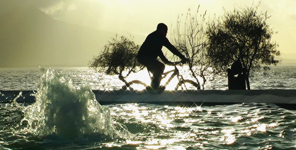 Bicycle Is Passing Near The Water Pool