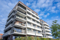 Modern apartment building with sunlit balconies - PhotoDune Item for Sale