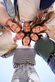 Vertical multiracial group young happy people standing in circle and smiling excited at camera.  - PhotoDune Item for Sale