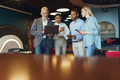 Group of people discussing daily plans in modern office using laptop. Business teamwork situation - PhotoDune Item for Sale